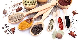 Journey of spices: colorful spices from around the world displayed in bowls, highlighting global trade and culinary history.