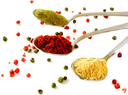 Journey of spices: A colorful assortment of spices in bowls, highlighting their variety, textures, and vibrant colors.