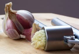 Clove of garlic with minced garlic.